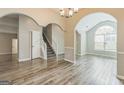 Spacious living room boasts modern floors, arched entryways, and abundant natural light at 2635 Carolina Rdg, Riverdale, GA 30296