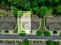 Aerial view of the home and landscaping surrounded by mature trees in a well-kept neighborhood at 140 Rehobeth Way, Fayetteville, GA 30214