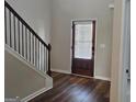 Welcoming entryway with hardwood floors and a view of the wooden front door at 236 Villa Grande Dr, Locust Grove, GA 30248