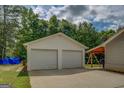 Spacious two-car detached garage with ample parking space, offering convenience and storage at 527 Malcom Rd, Covington, GA 30014