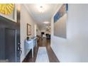 Bright entryway with hardwood floors, elegant console table, and neutral decor at 3018 Patriots Square, Marietta, GA 30064