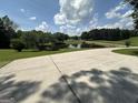 Scenic view of a tranquil pond surrounded by lush greenery and a sprawling lawn at 370 Rosetta Nw Ln, Conyers, GA 30012