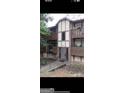 Multi-story exterior showcasing multiple balconies, and neutral toned paint scheme at 1308 Camelot Dr, South Fulton, GA 30349