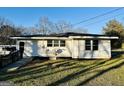 Side view of a home featuring a wheelchair ramp and satellite dish at 225 Bell St, Covington, GA 30016