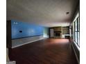 A spacious living room with hardwood floors and a stone fireplace feature at 6679 Cameron Rd, Morrow, GA 30260