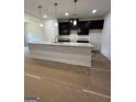 Modern kitchen featuring granite countertops, stainless steel appliances and sleek cabinetry with lots of space at 11156 Cornerstone Way, Hampton, GA 30228
