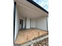 Covered patio area perfect for outdoor relaxation and entertaining at 11156 Cornerstone Way, Hampton, GA 30228