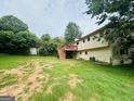 The backyard has a wooden deck with stairs at 1766 Tilden Ave, Jonesboro, GA 30236