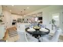 Bright dining area featuring stylish chairs, a round table, and an open view to the gourmet kitchen at 38 Avian Way # 126B, Auburn, GA 30011