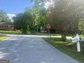 A street view showcasing the neighborhood with tree-lined streets and the surrounding houses at 4109 Francis Ne St, Covington, GA 30014