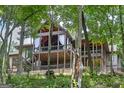 Large rear porch and wood ceiling provides beautiful views of wooded backyard at 177 Selfridge Rd, Mcdonough, GA 30252