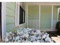 Inviting porch with white railing and blooming flowers at 905 Ohara Dr, Jonesboro, GA 30236