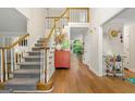 Grand foyer with hardwood floors, staircase, and views into the dining and living spaces at 4645 Villa Ridge Ne Rd, Marietta, GA 30068