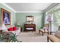 Cozy living room with large window, neutral paint, and comfortable seating at 105 Roxbrough Ln, Fayetteville, GA 30215