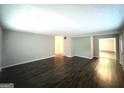 Spacious living room with new flooring, neutral paint and ample natural light at 3456 Spring Cir, Decatur, GA 30032
