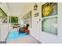 Inviting front porch with comfy seating, cheerful decor, and a welcoming entrance, creating a cozy outdoor space at 394 Thornbrooke Dr, Hiram, GA 30141