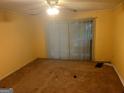 Bright bedroom with sliding glass doors to the outside, ceiling fan, and neutral-toned walls at 7 Willowick Dr, Lithonia, GA 30038