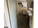 Traditional-style kitchen featuring wood countertops, black appliances, and ample cabinet space at 7 Willowick Dr, Lithonia, GA 30038