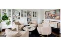 Inviting living room features neutral tones, plush seating, and elegant decor at 1952 Sugarstone Dr, Lawrenceville, GA 30043
