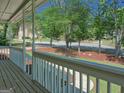 Scenic view from the front porch showcasing the peaceful neighborhood and mature trees at 902 Sweetbay Ct, Stockbridge, GA 30281