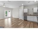 Spacious living room with modern flooring and a door to the outside at 3135 Journal Ct, Decatur, GA 30035