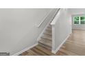 Inviting staircase with carpeted steps and hardwood floors at 3135 Journal Ct, Decatur, GA 30035