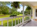 Charming front porch with hanging ferns and flower boxes showcasing outdoor living at 135 Cherokee Pl, Fayetteville, GA 30215