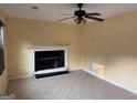 Bright living room featuring a ceiling fan, fireplace and tile flooring at 990 Hickory Bend Rd, Atlanta, GA 30349
