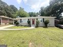 Charming single-story home with a well-manicured front yard and inviting curb appeal at 2015 Boulderview Se Dr, Atlanta, GA 30316