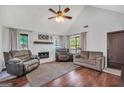 Inviting living room showcasing a vaulted ceiling, fireplace, and comfortable seating area at 250 Stallsworth Rd, Mcdonough, GA 30252