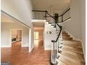 Grand foyer featuring a staircase with decorative banisters at 2325 Lochinver Sw Ln, Conyers, GA 30094