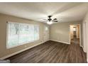 Bright living room with large windows, new floors and freshly painted walls at 4385 Midway Rd, Douglasville, GA 30134