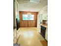 Bright kitchen with white cabinets, view of window, and vintage appliances at 402 Stone St, Oxford, GA 30054