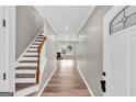 Inviting entryway featuring new floors, fresh paint, and a view to the living room and fireplace at 583 Whitaker Nw St, Atlanta, GA 30318