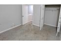 Neutral bedroom with carpet, closet, and view into laundry area through an adjacent doorway at 2378 Charleston Se Pt, Atlanta, GA 30316