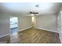 Open living room featuring wood-look flooring and a view into the adjacent kitchen at 2327 Scotty Cir, Decatur, GA 30032