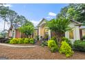 Beautiful single-story home with brick facade, manicured landscaping, and inviting entrance at 107 Calloway Xing, Peachtree City, GA 30269