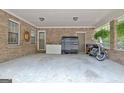 Attached brick carport offering ample storage and parking at 260 Sharon Dr, Fayetteville, GA 30214