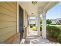 Inviting front porch with stately columns at 6131 Sparkling Cove Ln, Buford, GA 30518