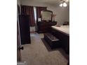 The main bedroom showcases a dresser, mirror, and bed, providing a comfortable retreat within the home at 5840 Butner Rd, South Fulton, GA 30349