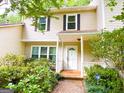 Inviting two-story townhome with a classic white front door and well-maintained landscaping at 3150 Stratford Green Pl, Avondale Estates, GA 30002