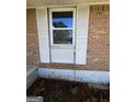 Close up of brick wall and white shutters outside the home at 7128 Lady Heidi Ct, Jonesboro, GA 30236