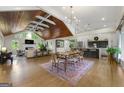 Bright, open-concept living space featuring hardwood floors, vaulted wood ceiling and modern kitchen with island at 2944 Braithwood Ne Ct, Atlanta, GA 30345