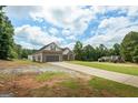 Side view of attractive single Gathering home on a lot with an extra long driveway at 501 Llewellyn Ct, Jenkinsburg, GA 30234