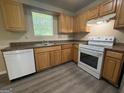 Bright kitchen featuring laminate countertops and white appliances at 756 Glenshire Ct, Riverdale, GA 30274