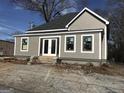 A newly renovated exterior featuring new siding, roof, windows, and double glass doors at 1419 Cleveland Ave, Atlanta, GA 30344