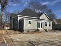 A newly renovated exterior featuring new siding, roof, windows, and double glass doors at 1419 Cleveland Ave, Atlanta, GA 30344