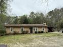 Charming single-story home featuring a covered deck and lots of natural light from the windows at 4389 & 4381 Campbell Rd, Snellville, GA 30039