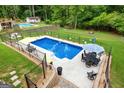 Aerial view of a backyard featuring a sparkling in-ground pool at 345 Wynbrook Dr, Mcdonough, GA 30253