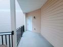 A cozy porch entrance to the residence with a white front door at 1392 Orchard Park Dr, Stone Mountain, GA 30083